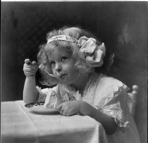 Black and white image of a little girl eating ice cream from the Library of Congress free use collection